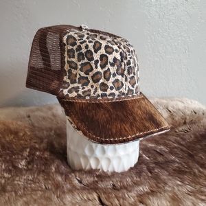 Ball cap with hand-sewn leather patch on brim
